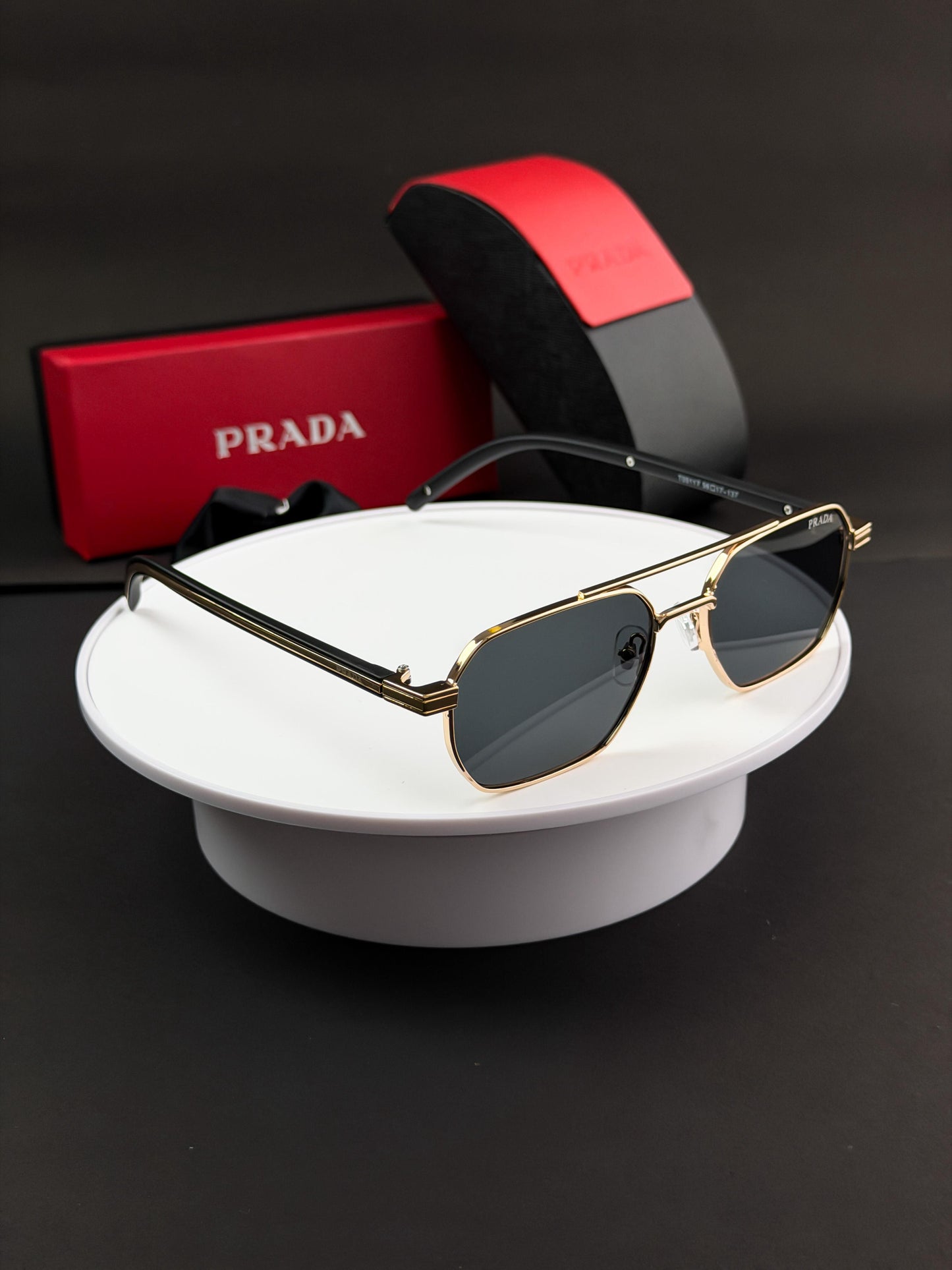 PRADA GOLD BLACK SUNGLASSES