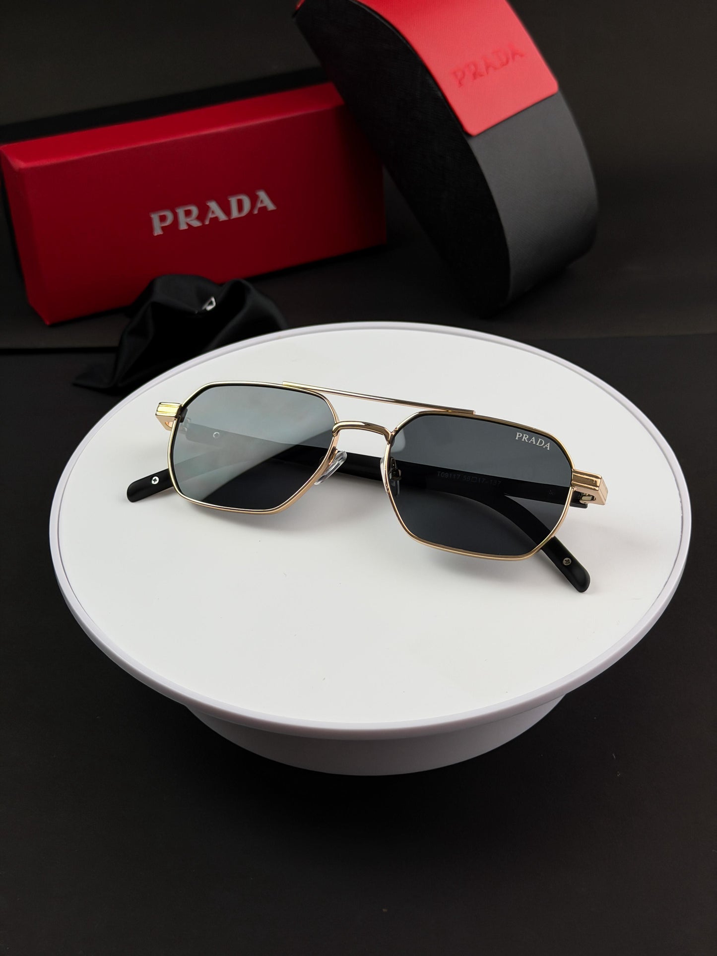 PRADA GOLD BLACK SUNGLASSES