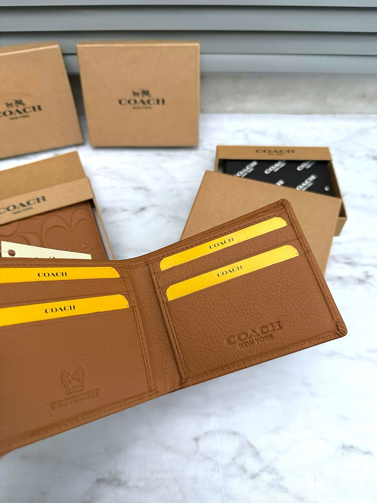 COACH LEATHER WALLETS
